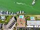 Aerial view of waterfront property with private docks, multiple pools, and lush landscaping at 350 Pinellas Bayway S # 2, St Petersburg, FL 33715