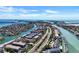 Gorgeous aerial view of the waterfront community with stunning canal and ocean views on a sunny day at 350 Pinellas Bayway S # 2, St Petersburg, FL 33715