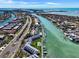 Breathtaking aerial view of waterfront properties, showcasing the canal, pools, and lush landscaping in a desirable coastal community at 350 Pinellas Bayway S # 2, St Petersburg, FL 33715