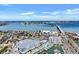 Scenic aerial view featuring coastal neighborhood, waterway, marina, and distant bridge on a clear, sunny day at 350 Pinellas Bayway S # 2, St Petersburg, FL 33715