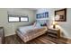 Comfortable bedroom with patterned bedding, side table, and a calming aesthetic at 350 Pinellas Bayway S # 2, St Petersburg, FL 33715