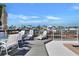 Comfortable waterfront deck featuring ample seating and picturesque marina views at 350 Pinellas Bayway S # 2, St Petersburg, FL 33715
