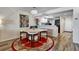 Bright dining area with modern chandelier and access to the kitchen at 350 Pinellas Bayway S # 2, St Petersburg, FL 33715
