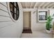 Charming front porch with unique circular window and white wood siding at 350 Pinellas Bayway S # 2, St Petersburg, FL 33715