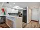 Efficient white kitchen with stainless appliances and lots of counterspace at 350 Pinellas Bayway S # 2, St Petersburg, FL 33715