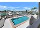 Inviting waterfront pool offers a picturesque view of boats in the channel and clear blue skies at 350 Pinellas Bayway S # 2, St Petersburg, FL 33715