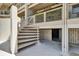 Exterior view of a staircase, leading to an upper level with a storage area beneath at 350 Pinellas Bayway S # 2, St Petersburg, FL 33715