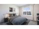 Cozy bedroom featuring neutral walls, stylish decor, a large window with natural light, and a comfortable-looking bed at 35138 Valley Ridge Rd, Dade City, FL 33525