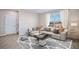 Bright living room with a large window, stylish furniture, and an elegant area rug at 35138 Valley Ridge Rd, Dade City, FL 33525