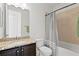 Clean bathroom with a combination tub and shower at 3615 W Kensington Ave, Tampa, FL 33629