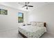 Bright bedroom with natural light, ceiling fan, and pleasant view at 3615 W Kensington Ave, Tampa, FL 33629