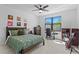 Comfortable bedroom featuring a ceiling fan, and a window to bring natural light in at 3615 W Kensington Ave, Tampa, FL 33629