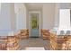 Elegant front entrance with stone pillars and a stylish glass door at 3615 W Kensington Ave, Tampa, FL 33629