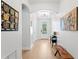 Light and airy foyer with elegant decor, hardwood floors, and decorative glass front door at 3615 W Kensington Ave, Tampa, FL 33629