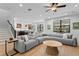 Spacious living room with hardwood floors, recessed lighting, and a comfortable sectional sofa at 3615 W Kensington Ave, Tampa, FL 33629