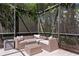 Relaxing outdoor seating area inside of a screened enclosure at 3615 W Kensington Ave, Tampa, FL 33629