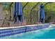 Tranquil waterfall feature cascading into the pool at 3615 W Kensington Ave, Tampa, FL 33629