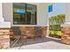 Charming front porch with stone accents and comfortable seating at 3615 W Kensington Ave, Tampa, FL 33629