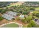 Aerial view showcases community amenities, featuring tennis courts, a swimming pool, playground, and green spaces in a vibrant setting at 3633 Cordgrass Dr, Valrico, FL 33596