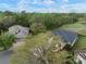 Aerial view of a home next to golf course with mature trees and landscaping at 3633 Cordgrass Dr, Valrico, FL 33596