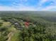 Aerial view showcases home's location nestled among lush greenery and golf course at 3633 Cordgrass Dr, Valrico, FL 33596