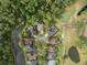 Stunning aerial view of homes with pools nestled near a golf course and a serene lake surrounded by lush greenery at 3633 Cordgrass Dr, Valrico, FL 33596