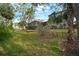 This backyard features a private view, golf course access, and a screened in lanai at 3633 Cordgrass Dr, Valrico, FL 33596