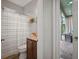 This bathroom features a shower and vanity with access to an outdoor patio at 3633 Cordgrass Dr, Valrico, FL 33596