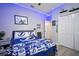 Cozy bedroom with blue accents and natural light, providing a relaxing atmosphere at 3633 Cordgrass Dr, Valrico, FL 33596