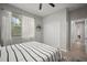 Neutral bedroom featuring crisp white window coverings at 3633 Cordgrass Dr, Valrico, FL 33596