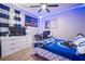 Bright bedroom with neutral colors and a workspace, offering a serene environment at 3633 Cordgrass Dr, Valrico, FL 33596