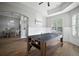 Open bonus room showing wood-look floors, ceiling fan, and views to dining area at 3633 Cordgrass Dr, Valrico, FL 33596