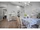 Dining area view showcasing wood-look floors and open layout to other rooms at 3633 Cordgrass Dr, Valrico, FL 33596