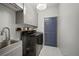 Well-organized laundry room with ample storage and modern appliances at 3633 Cordgrass Dr, Valrico, FL 33596