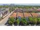 Aerial view of a complex with tile roofs, mature trees, and landscaped gardens at 402 S Armenia Ave # 137, Tampa, FL 33609