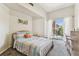Bright bedroom with balcony access, offering a blend of indoor comfort and outdoor serenity at 402 S Armenia Ave # 137, Tampa, FL 33609