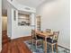 Charming dining room with hardwood floors, adjacent kitchen, and natural light at 402 S Armenia Ave # 137, Tampa, FL 33609