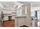 Bright kitchen featuring white cabinets, stainless steel appliances, granite countertops, and hardwood floors at 402 S Armenia Ave # 137, Tampa, FL 33609