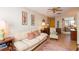 Cozy living room featuring tile floors, neutral walls, and a comfortable couch with decorative throw pillows at 4101 W El Prado Blvd, Tampa, FL 33629