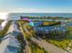 Aerial view of waterfront condos boasting boat docks and stunning water views of the bay and the city skyline at 418 Bahia Beach Blvd, Ruskin, FL 33570