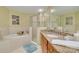 Bathroom featuring an enclosed shower, bath tub, and vanity with granite countertop at 418 Bahia Beach Blvd, Ruskin, FL 33570