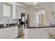 Kitchen featuring stainless steel appliances, granite countertops, and seamless flow into the living space at 418 Bahia Beach Blvd, Ruskin, FL 33570