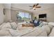 Cozy living room with comfortable sofas and large windows, offering an inviting space with views of the outdoors at 418 Bahia Beach Blvd, Ruskin, FL 33570
