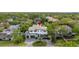 Aerial view of a two-story home backing up to a canal and surrounded by mature trees at 4806 W San Rafael St, Tampa, FL 33629