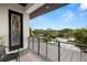 Enjoy the beautiful waterfront view from this balcony with modern railings and a seating area at 4806 W San Rafael St, Tampa, FL 33629