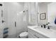 Modern bathroom featuring a glass-enclosed shower, sleek fixtures, and white subway tile at 4806 W San Rafael St, Tampa, FL 33629