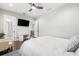 Bright bedroom featuring hardwood floors and access to the bathroom and hallway at 4806 W San Rafael St, Tampa, FL 33629