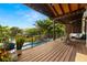 Spacious outdoor deck overlooking a canal with lush landscaping and a resort style pool at 4806 W San Rafael St, Tampa, FL 33629