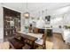 Open-concept kitchen with island, dining area, wine storage and stainless steel appliances at 4806 W San Rafael St, Tampa, FL 33629