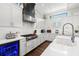 Beautiful kitchen with white cabinets, quartz countertops, and stainless steel appliances at 4806 W San Rafael St, Tampa, FL 33629